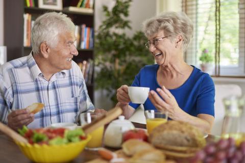 A man and woman enjoying a meal and conversation together