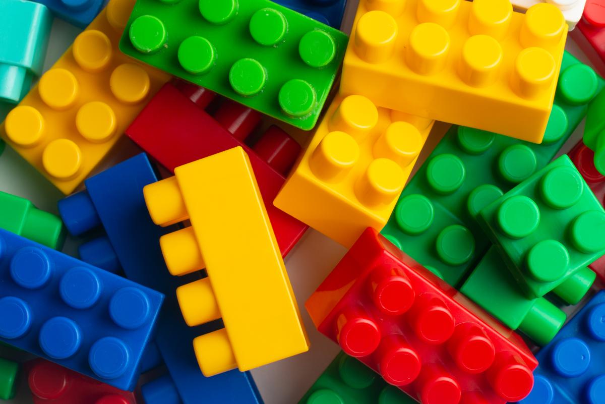 a closeup of a pile of red, green, yellow, and blue Legos