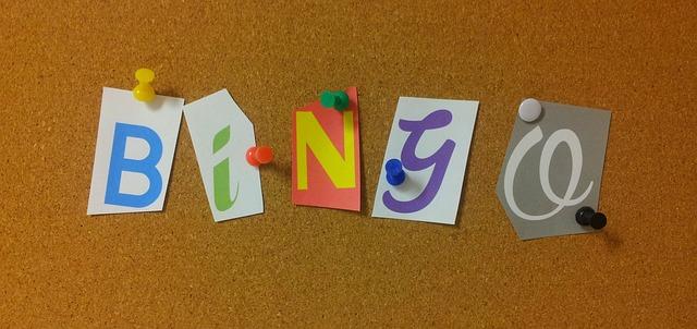 Colorful letters pinned to a bulletin board spelling "Bingo."