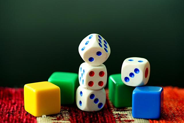 A pile of colored squares and dice.